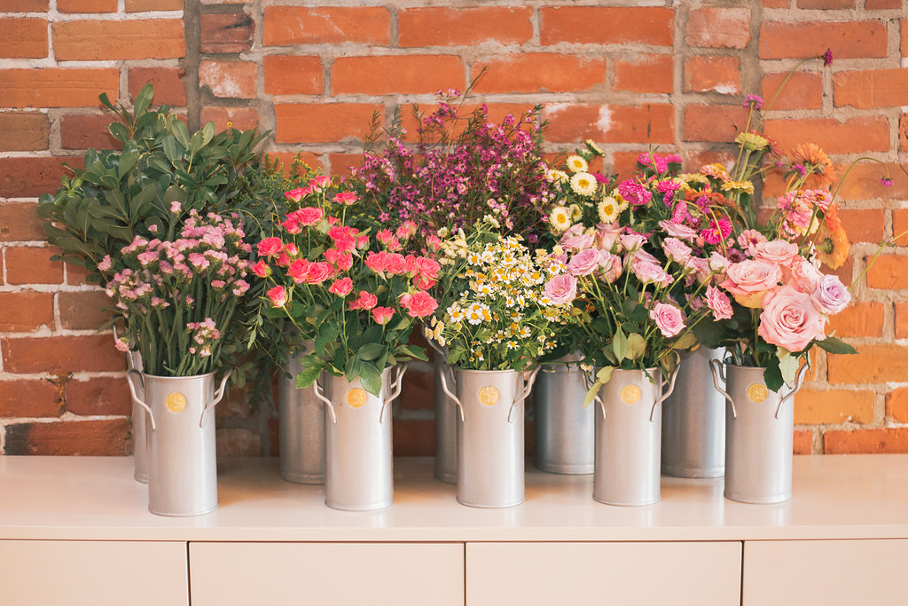 Selection of flowers in silver containers